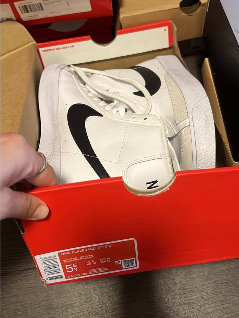 Nike White Leather High-Top Sneakers with Black Swoosh